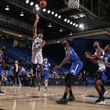 Wisconsin Herd Guard TREVON DUVAL (0) and Delaware-native drives towards the basket as Delaware Bluecoats Center NORVEL PELLE (1) watches in the second half of a NBA G-league regular season basketball game between the Delaware Blue Coats and the Wisconsin Herd (Milwaukee Bucks) Wednesday, Nov. 28, 2018, at The Bob Carpenter Sports Convocation Center in Newark, DEL. Photo By Saquan Stimpson